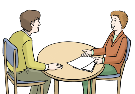 Ein Mann und eine Frau sitzen sich am Tisch gegenüber- Sie sprechen miteinander.