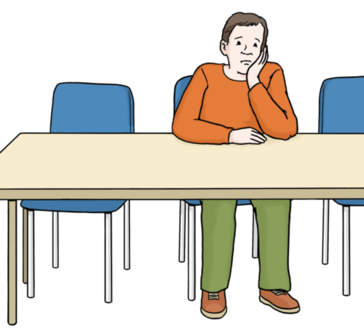 Ein Mann sitzt einsam am Tisch und stützt seinen Kopf seiner Hand.