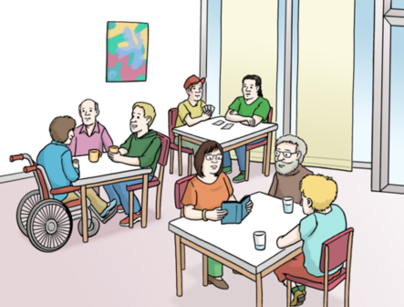 In einen größeren Raum sitzen Menschen mit Behinderung an Tischen zuammen und verbringen gemeinsam Zeit.