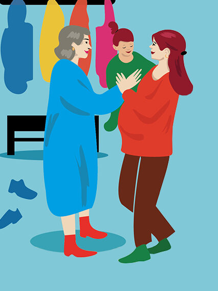 Im Kindergarten. Ein Frau übergibt ihr Kind an ein Erzieherin.