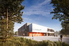 The visualization shows a modern square building in the middle, which is partially clad with wooden modules.